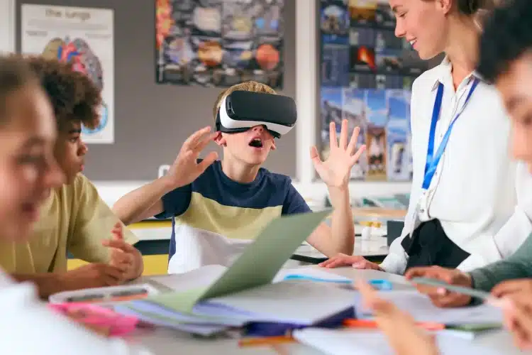 Student using VR headset in a classroom, showcasing an immersive eLearning platform front-end.