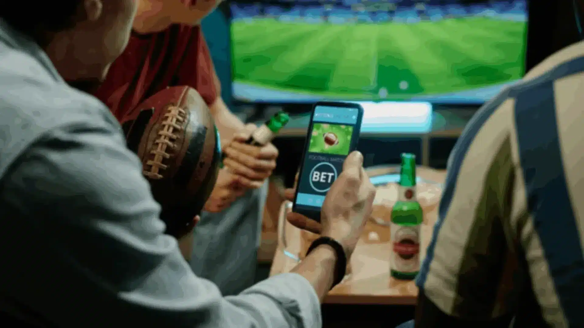 Friends watching sports and using a betting app on a smartphone, representing React Native sports app development.