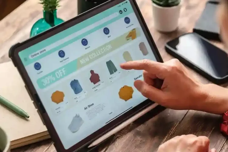 A person uses an omnichannel inventory and sales dashboard on a tablet to view products.