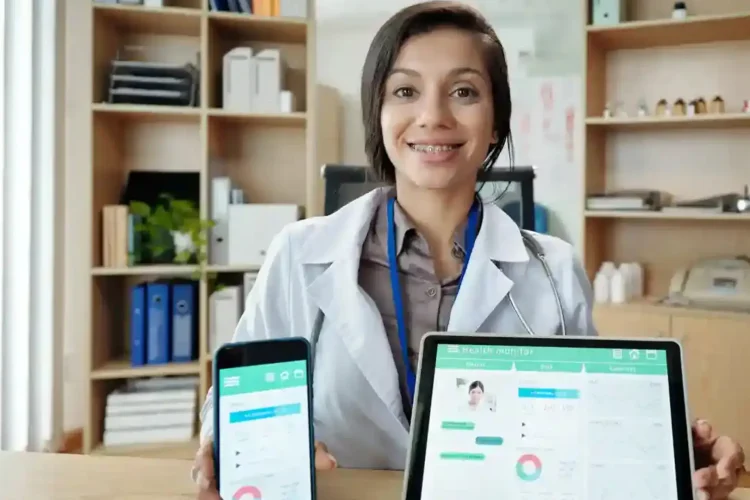 A female doctor shows a smartphone and tablet with a unified healthcare platform.