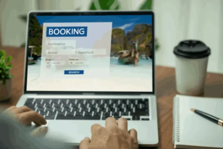 Hands on a laptop with a booking screen, showcasing travel Booking API development.
