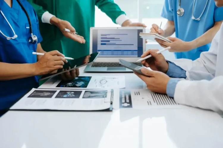 A medical team uses a digital platform to review patient data, an example of a Healthcare Platform MVP.