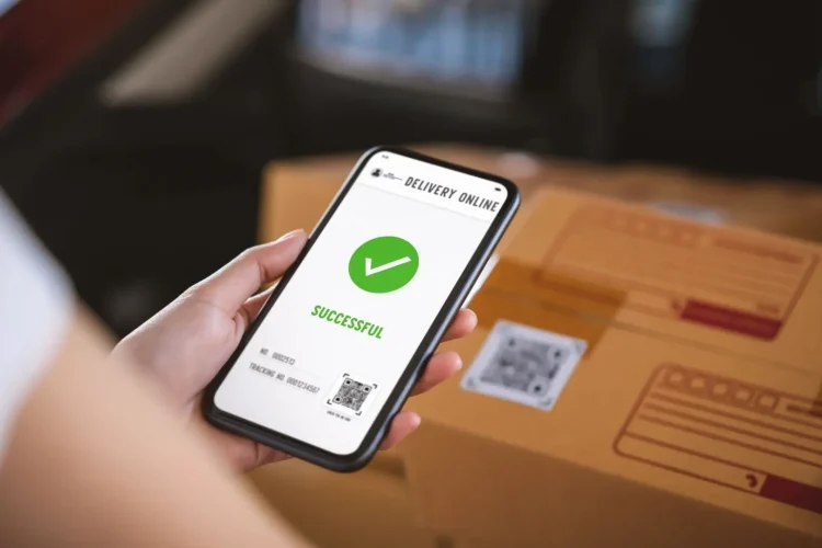 A person's phone shows a successful delivery, highlighting the efficiency of Supply Chain Management Software.